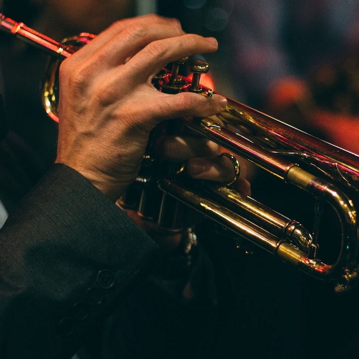 Person playing trumpet closeup